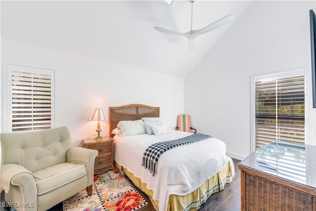 bedroom featuring ceiling fan, hardwood / wood-style flooring, and high vaulted ceiling