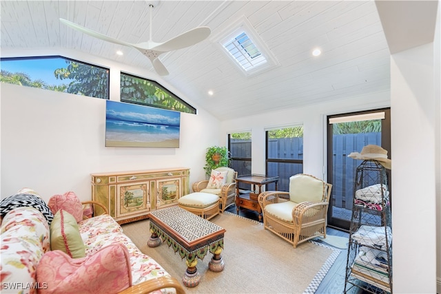 living room with vaulted ceiling with skylight, wood ceiling, hardwood / wood-style flooring, and ceiling fan