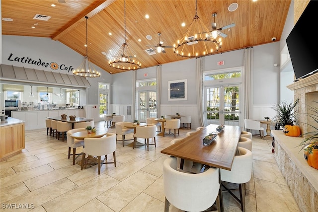 dining room featuring french doors, a chandelier, and wooden ceiling