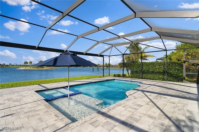 view of pool with a water view, an in ground hot tub, a patio area, and glass enclosure