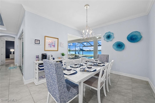 tiled dining room featuring ornamental molding and a water view