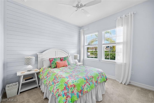 bedroom with light carpet and ceiling fan