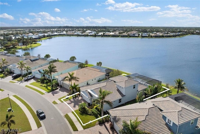 birds eye view of property with a water view