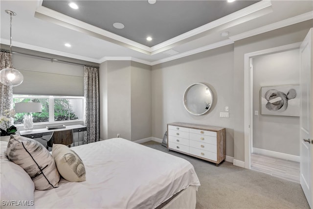 bedroom featuring light colored carpet, a raised ceiling, and ornamental molding