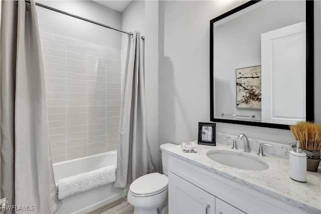 full bathroom featuring hardwood / wood-style floors, vanity, shower / bath combination with curtain, and toilet