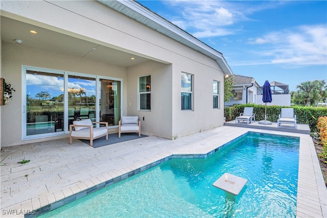 view of swimming pool with a patio area