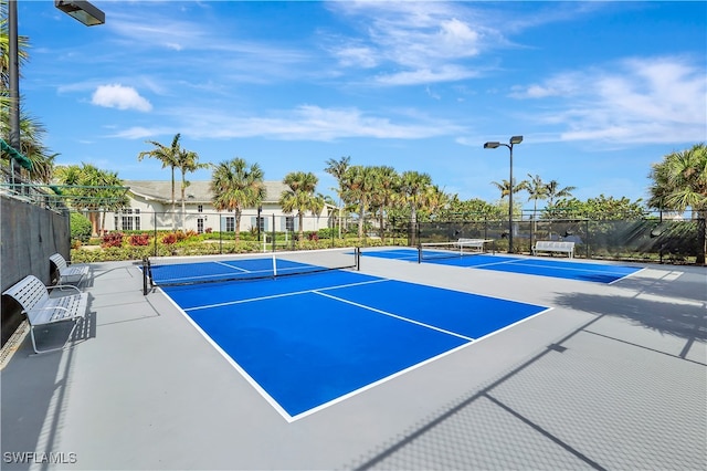 view of sport court with basketball hoop