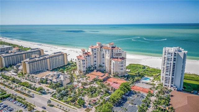 aerial view with a water view and a view of the beach