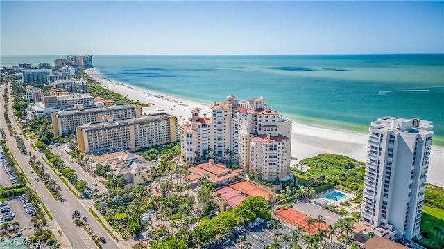 bird's eye view featuring a view of the beach and a water view