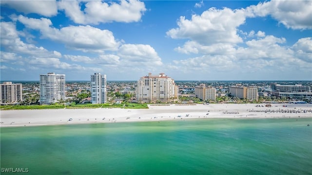 aerial view featuring a view of the beach and a water view