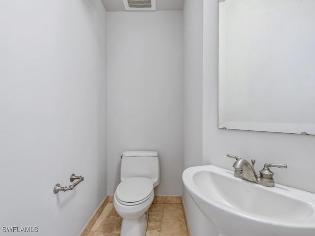 bathroom with sink and toilet