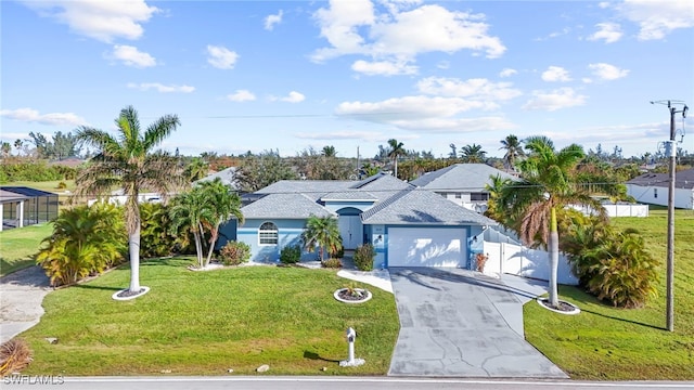 view of front of property featuring a garage and a front lawn