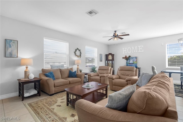 living room with ceiling fan and light tile patterned floors