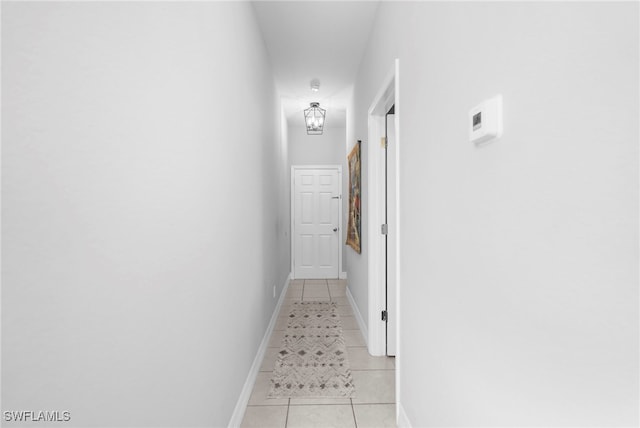 hallway featuring light tile patterned floors