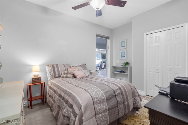 bedroom featuring light carpet, a closet, and ceiling fan