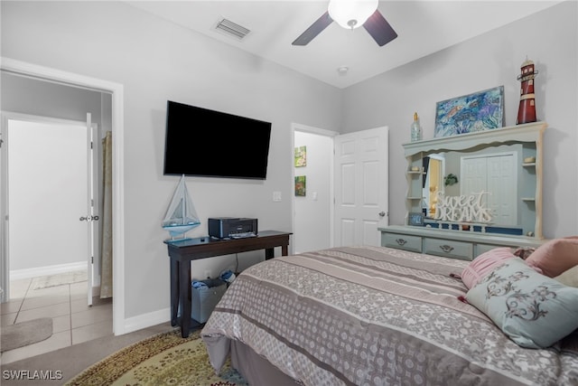 tiled bedroom with ceiling fan