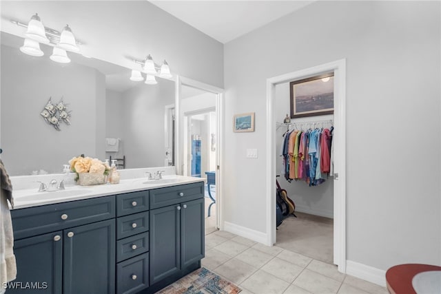 bathroom with vanity and tile patterned flooring