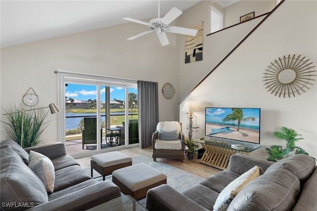 living room featuring wood-type flooring, high vaulted ceiling, and ceiling fan