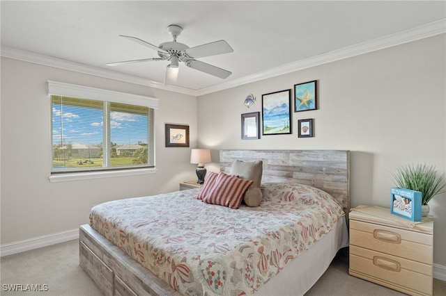 bedroom featuring ceiling fan, crown molding, and light colored carpet