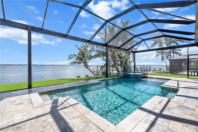 view of pool featuring an in ground hot tub, a water view, glass enclosure, and a patio