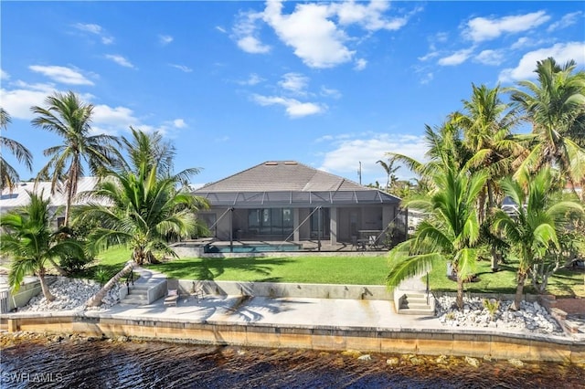 view of home's community featuring a pool, a water view, and a yard