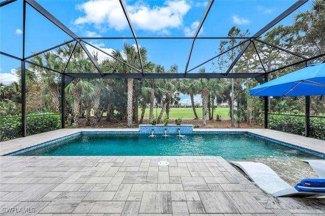 view of pool with a lanai, pool water feature, and a patio area