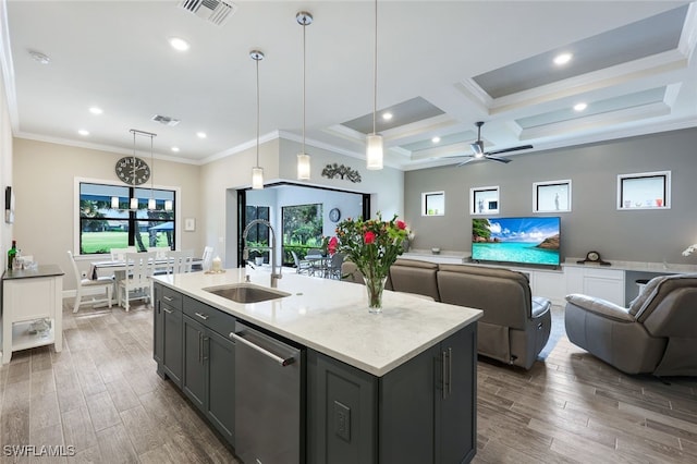 kitchen featuring a wealth of natural light, coffered ceiling, hanging light fixtures, and sink