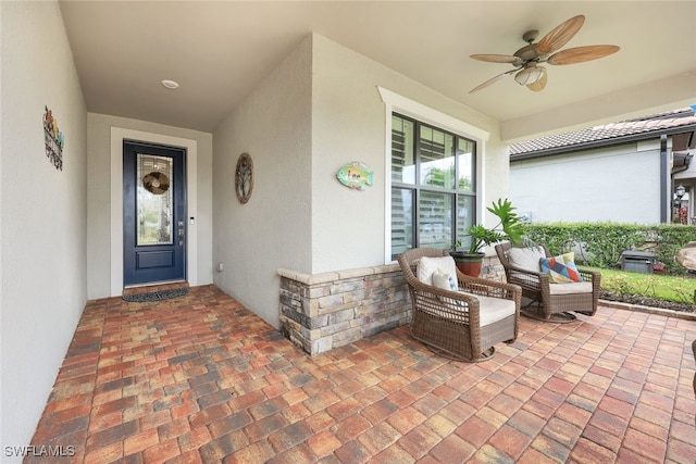 entrance to property with ceiling fan