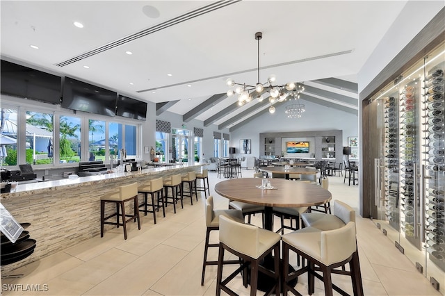 tiled dining area with lofted ceiling with beams and a chandelier