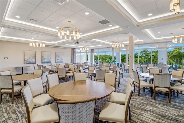 carpeted dining room featuring expansive windows