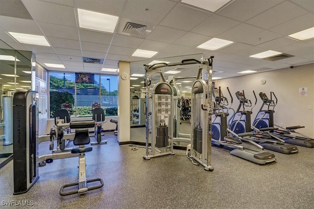 exercise room featuring a drop ceiling