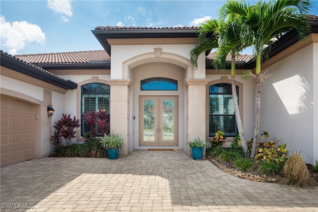 doorway to property featuring a garage