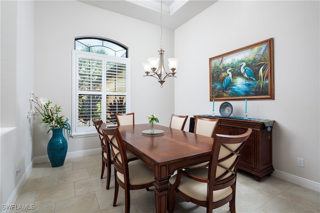 dining area featuring a notable chandelier