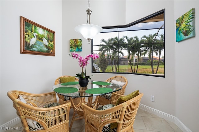 dining area with light tile patterned flooring