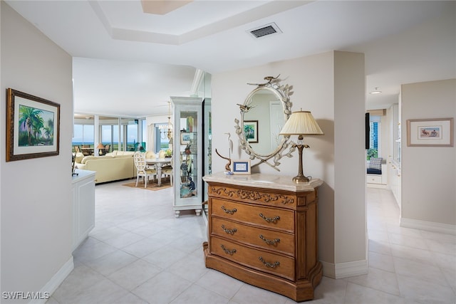 hall featuring light tile patterned flooring