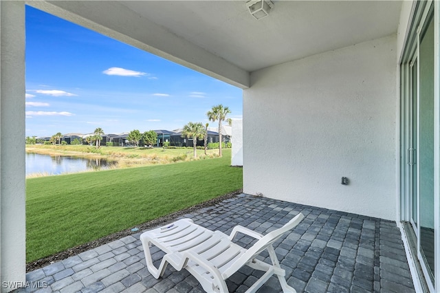 view of patio / terrace with a water view