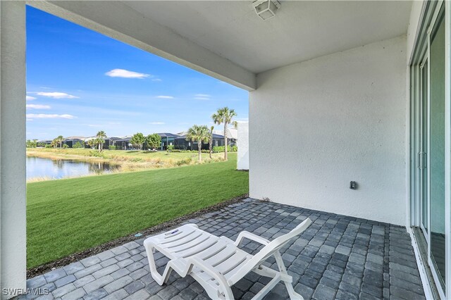 view of patio / terrace with a water view