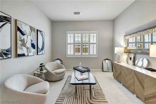 living area with light colored carpet