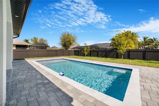 view of swimming pool featuring a patio area