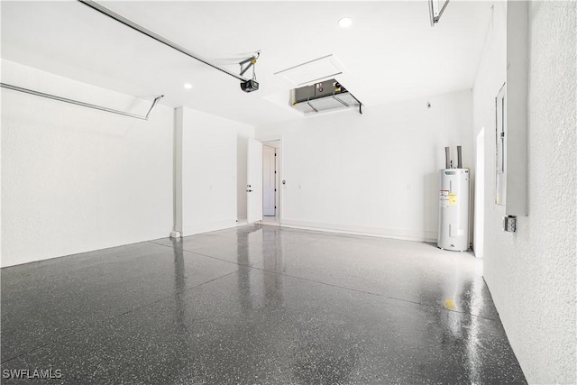 garage featuring electric water heater and a garage door opener