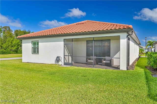 back of house with a patio and a yard