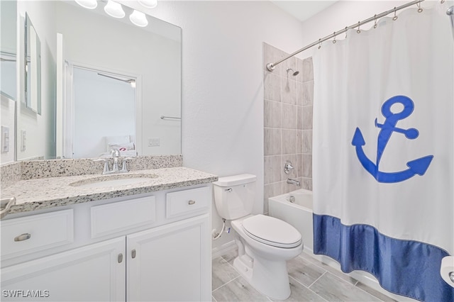 full bathroom with vanity, toilet, and shower / tub combo with curtain