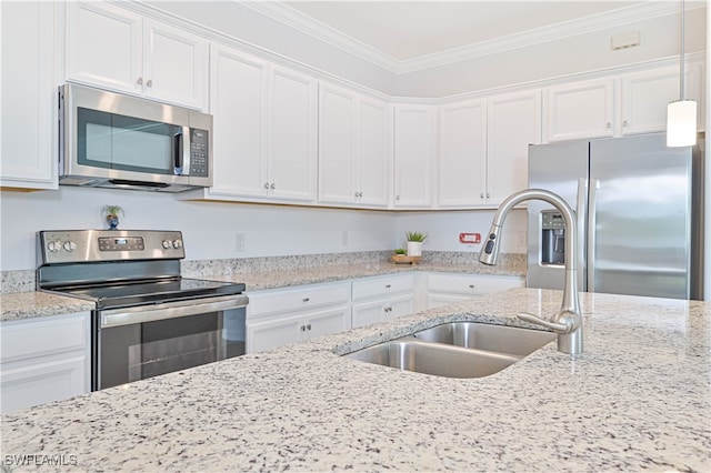 kitchen with white cabinetry, stainless steel appliances, ornamental molding, and sink