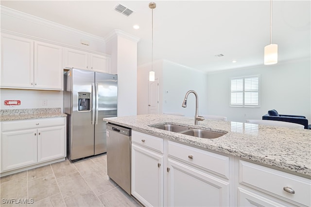 kitchen featuring hanging light fixtures, sink, crown molding, white cabinetry, and appliances with stainless steel finishes