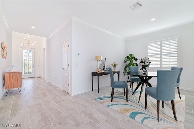 dining space with a healthy amount of sunlight and crown molding