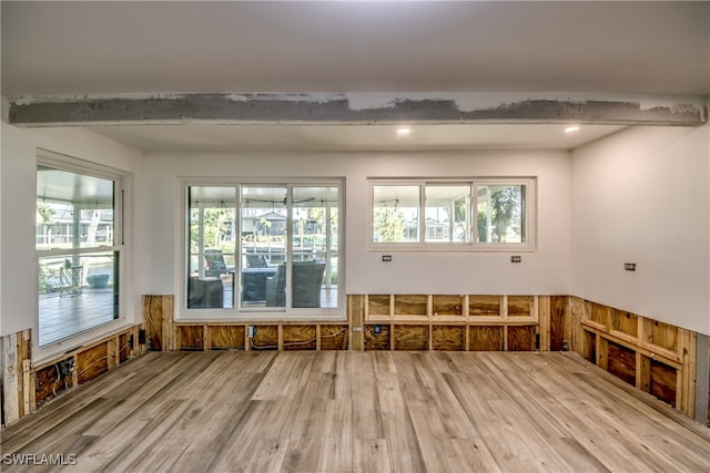 misc room featuring beam ceiling and hardwood / wood-style flooring