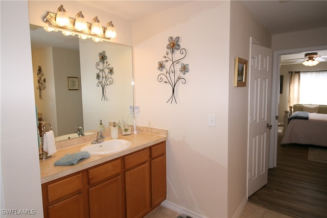 bathroom featuring vanity, wood-type flooring, and ceiling fan