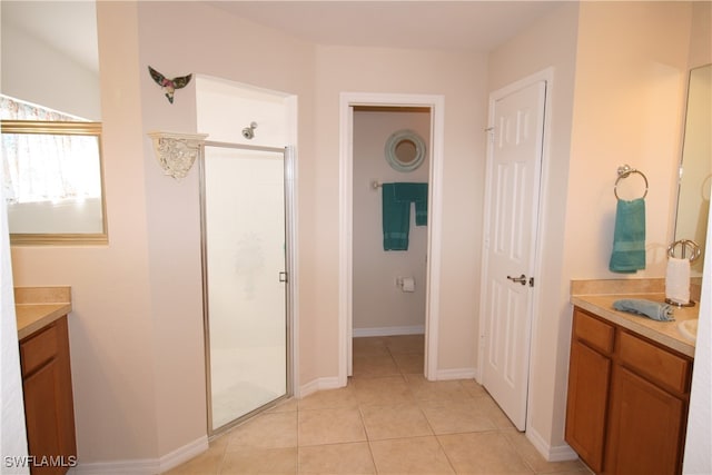 bathroom featuring vanity, tile patterned floors, and an enclosed shower