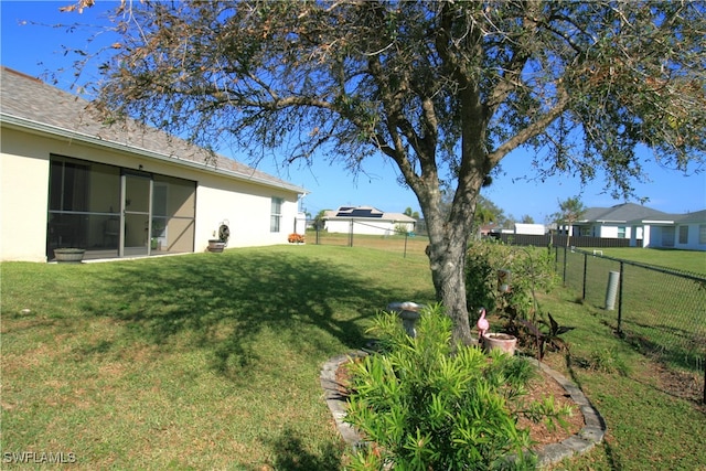 view of yard with a sunroom