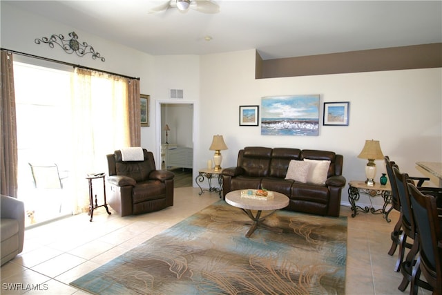 tiled living room featuring ceiling fan